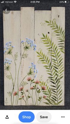 an image of flowers painted on wooden planks