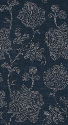 a blue background with white flowers and leaves in the center, as well as an intricate design