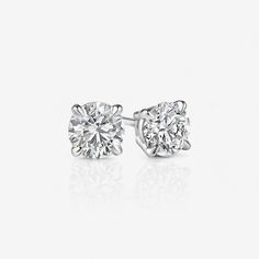 Timeless and beautiful, round diamond stud earrings add a classic elegance to any occasion; secured with four prongs. Not sure what backing type to get? Push-backs, also called friction backs, are the most common kind of earring backs. Screw-backs add extra security, so we recommend them for higher value earrings. Jumbo-backs, which are oversized push-backs, can be helpful for keeping oversized earrings from drooping. We recommend jumbo-backs for four-prong earrings that are 3.00 CTW and above. Round Diamond Stud Earrings, 1 Carat Engagement Rings, Round Diamond Earrings, Diamond Earrings Studs Round, Oversized Earrings, Diamond Earring, Yellow Gold Engagement Rings, Yellow Gold Engagement, Gold Necklace Layered