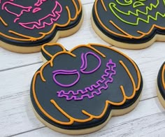 decorated halloween cookies with neon lights on them