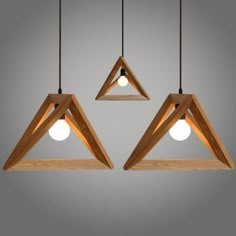 three wooden lights hanging from the ceiling with measurements for each light bulb in front of them