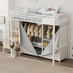 a white bunk bed sitting next to a baby's crib in a room