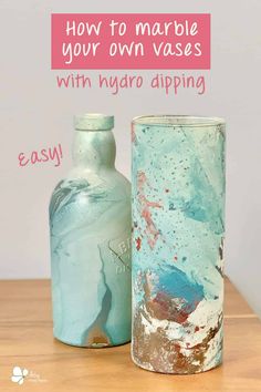 two vases sitting next to each other on top of a wooden table with text overlay that reads how to marble your own vases with hydro dipping easy