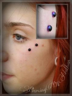 a woman with red hair has three piercings on her nose and behind her ear