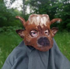 Original felted mask of a bull for lovers of reincarnation and fun. Unisex bull mask. The mask is made of Latvian wool and merino wool with the addition of viscose and linen fruits. The mask is made on a flat template, after which a three-dimensional 3D shape is offered to it. The mask is made by hand felting wool with water and soap. On the mask, I painted the muzzle of a bull using wool and linen. At the end of felting, I gave the mask the desired shape using natural gelatin. Therefore, the ma Bull Mask, Wolf Mask, Carnival Mask, Animal Mask, Felting Wool, 3d Shape, A Bull, Halloween Mask, Costume Masks