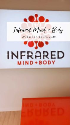 the infrared mind and body logo is displayed in front of a white sign with red lettering