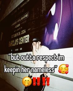 a man standing in front of a wall with emoticions on it and the words, but outata respect im keepin her nameless