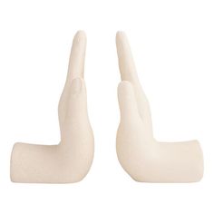 two white plastic hand gestures on a white background