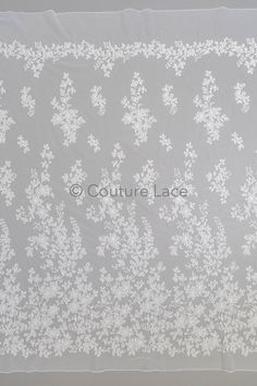 a white lace with flowers on it