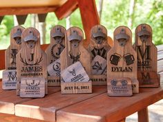 a group of wooden plaques sitting on top of a wooden table next to each other