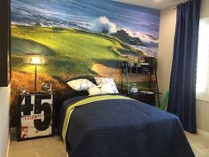 a bedroom with a large painting on the wall