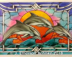 two dolphins jumping out of the water in front of a stained glass window at sunset