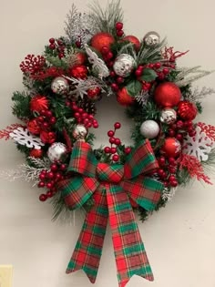 a christmas wreath hanging on the wall