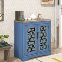 a blue cabinet sitting in the middle of a living room