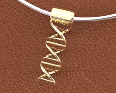 Original design of DNA Helix. Works with any bracelet, including Pandora Bracelets. Original design of DNA Helix Charm. Works with any bracelet, including Pandora Bracelets. The DNA Helix Charm is the perfect gift for the science fans. It's  made of solid casting Brass with 18K Gold Plated and hand finished. It will look fantastic hanging on the bracelet of your choice (bracelet not included). Quadrea Studios: Please check out the rest of our shop by clicking: https://quadreastudios.etsy.com Dna Helix, Bracelets Pandora, Bracelet Pandora, Pandora Bracelets, The Science, Helix, Charm Bracelets, Original Design, Original Designs