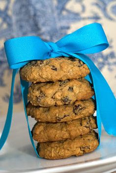 a stack of cookies tied with a blue ribbon