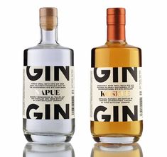 two bottles of gin are sitting side by side on a reflective surface, one has an orange cap and the other is white with black lettering