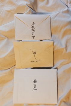 three envelopes sitting on top of each other