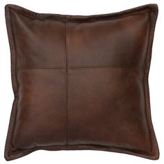 a brown leather pillow with square stitching on the front and back, isolated against a white background