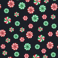 a black background with candy canes and green and red circles on it's surface