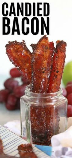 candied bacon in a jar next to grapes and an apple on the side with text overlay