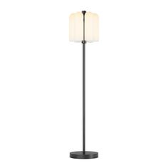 a black floor lamp with a white shade on the top and an off - white light at the bottom