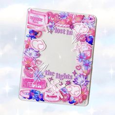 a pink and white photo frame with flowers, hearts and crosses on it in the sky