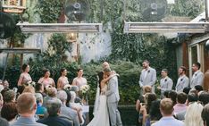 a couple getting married in front of an audience