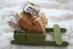 small wooden sleigh with musical notes wrapped in twine