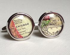 a pair of cufflinks with the chicago map on it's backset