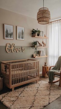 a baby's room with a crib, rocking chair and pictures on the wall