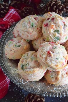 a silver plate filled with cookies on top of a table