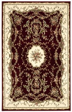 a red and white rug with an ornate design on the bottom, in front of a white background