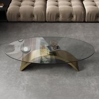 a glass coffee table sitting in front of a couch