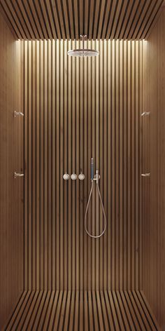 a shower with wooden walls and flooring