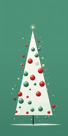 a white christmas tree with red and green ornaments on it's top, surrounded by confetti balls