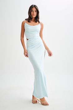 Allure unveiled. The JEMMA Draped Slinky Maxi Dress is a captivating blend of elegance and allure. It features a sophisticated cowl neckline and adjustable straps, allowing for a perfect fit. The asymmetrical draped waistline accentuates the silhouette, while a daring hip cutout adds a touch of modern edge. The asymmetrical hem enhances the flowing, graceful design of the dress. Fully lined for comfort, this maxi length dress is perfect for any special occasion where you want to make a stunning Elegant Blue Cowl Neck Dress, Blue Cowl Neck Party Dress, Fitted Ruched Maxi Dress With Cowl Back, Blue Fitted Cowl Neck Dress, Evening Ruched Maxi Dress With Cowl Neck, Evening Maxi Dress With Cowl Neck And Ruched Detail, Capsule Wardrobe Accessories, Capsule Wardrobe Basics, European Summer Outfits