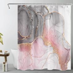 a shower curtain with an abstract design in pink, grey and gold on the outside