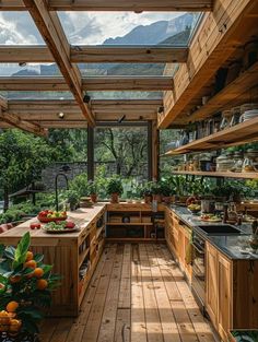 an outdoor kitchen with wooden floors and lots of greenery on the counter top,