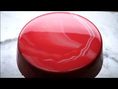 a red object sitting on top of a table