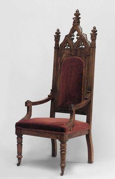 an old wooden chair with red upholstered seat and arm rests against a white background