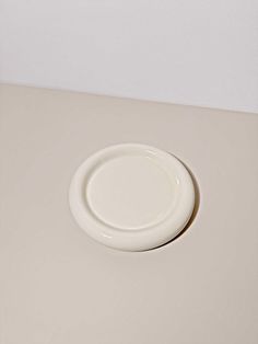 a white plate sitting on top of a table