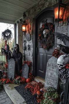 a decorated porch for halloween with tombstones and decorations on the front door, pumpkins and wreaths