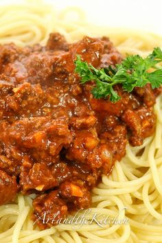 spaghetti with meat sauce and parsley on top