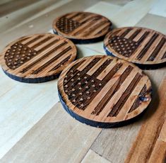 four wooden coasters with the american flag on them