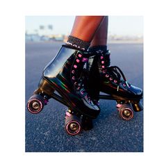 the legs and feet of a person wearing roller skates