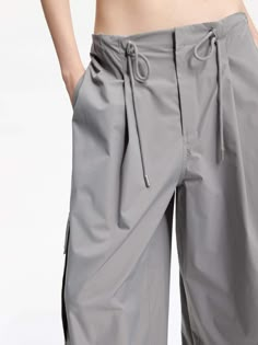 MO&Co. Women's Drawstring Detail Cargo Pants Made with breathable material, these pants feature a wide-leg cut and a drawstring waistband for a perfect fit. With multiple pockets, they are both functional and stylish. Pair them with our short cut T-shirt for a casual yet fashionable look. Features : - Wide leg cut, drawstring waistband- Concealed button, hook, and zipper closure- Multi pockets on the sides- UPF 40+ sun protection Code: MBD1PAT032The back length of size M is 106cmMATERIALS & CARE Cargo Pants Pockets, Casual Cargo Pants, Drawstring Detail, Pastel Grey, Cut T Shirt, Short Cut, Cut Tshirt, Mesh Bag, Pocket Pants