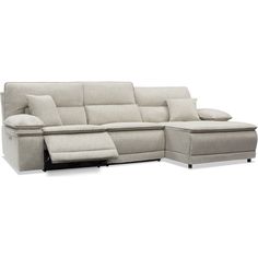 a sectional couch with pillows on it and a reclining chair in front of it