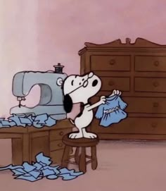 a cartoon dog sitting on a stool in front of a sewing machine and pile of clothes