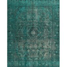 an antique rug with blue and green colors